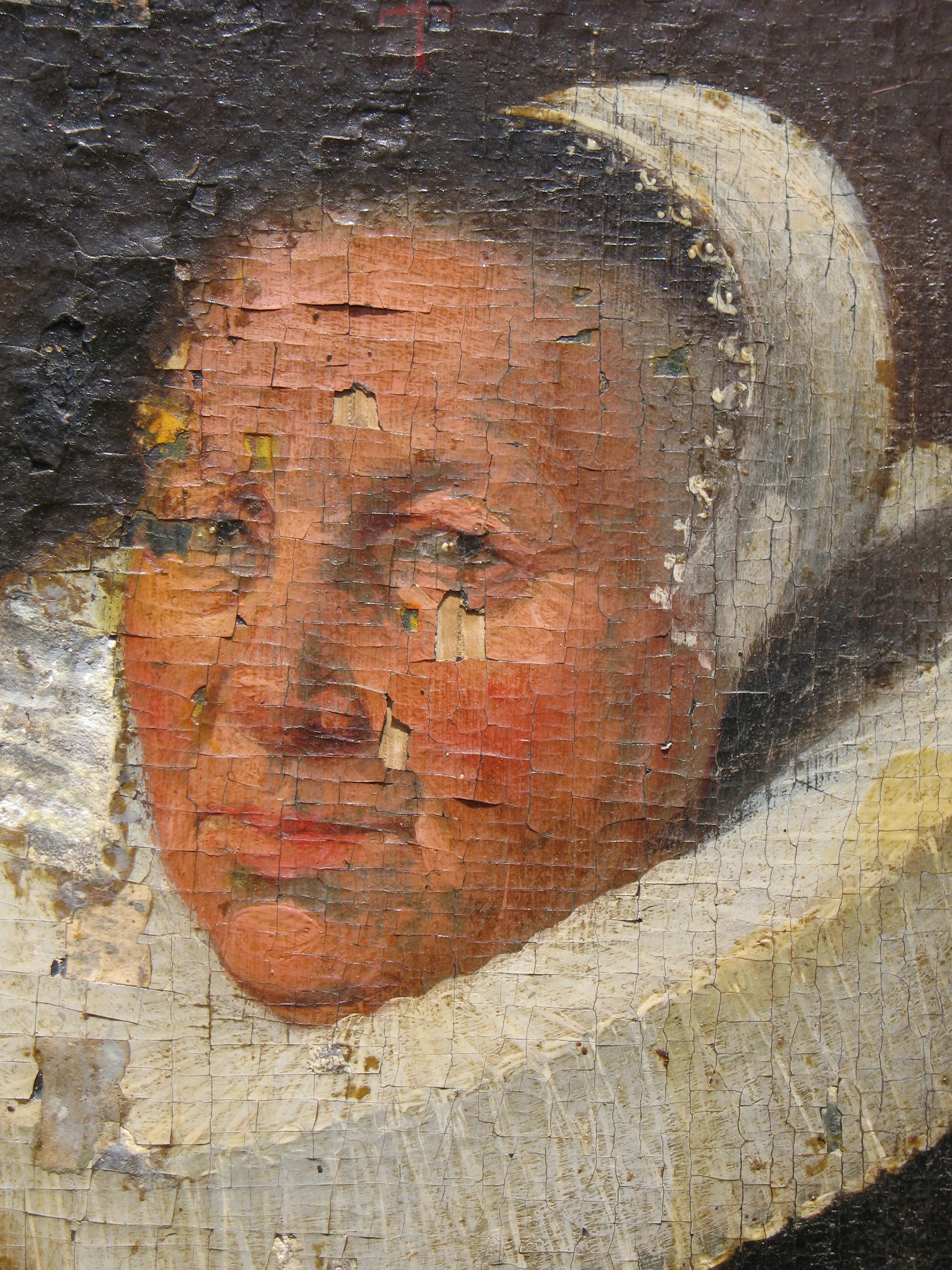 Traitement de craquelures instables sur un tableau à Antibes.